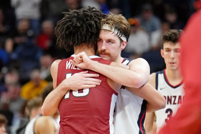 Gonzaga Bulldogs forward Drew Timme (2) hugs Arkansas Razorbacks forward Jaylin Williams (10) after the game in the semifinals of the West regional of the men's college basketball NCAA Tournament at Chase Center. The Arkansas Razorbacks won 74-68.